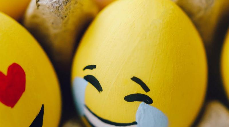 yellow smiley emoji painted eggs